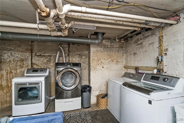 washroom featuring washer and clothes dryer