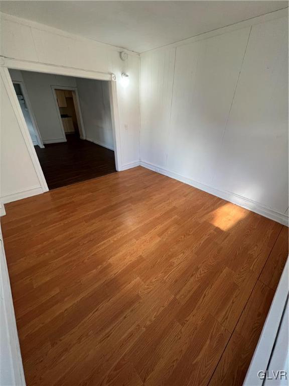 spare room featuring hardwood / wood-style floors