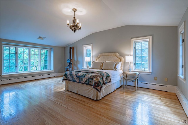 bedroom with an inviting chandelier, a baseboard radiator, vaulted ceiling, and light hardwood / wood-style floors