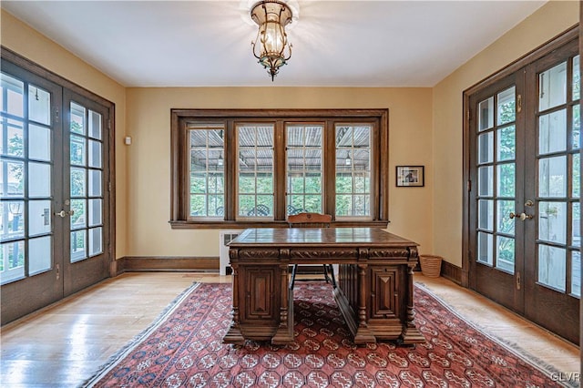 office area with french doors and a healthy amount of sunlight