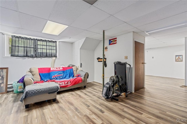 interior space with hardwood / wood-style floors and a paneled ceiling