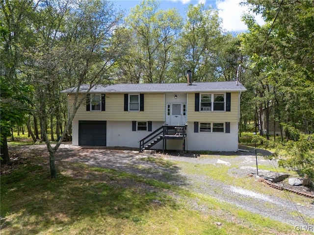 raised ranch featuring a garage