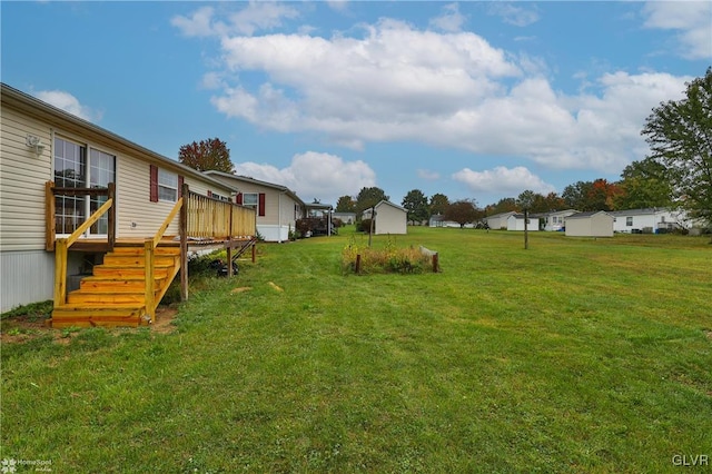 view of yard featuring a wooden deck