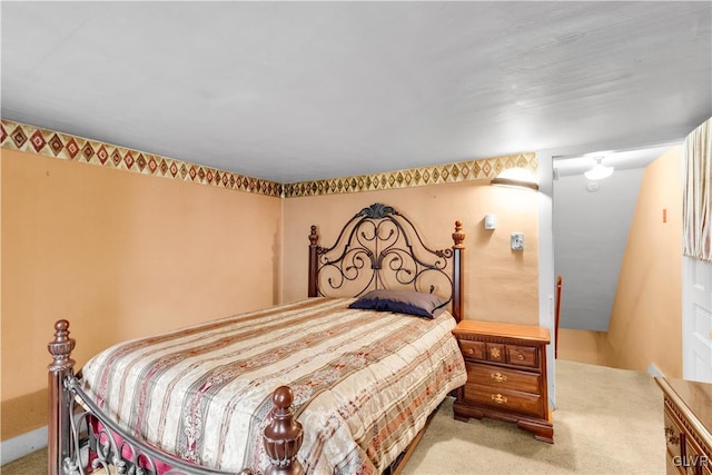 bedroom with light colored carpet