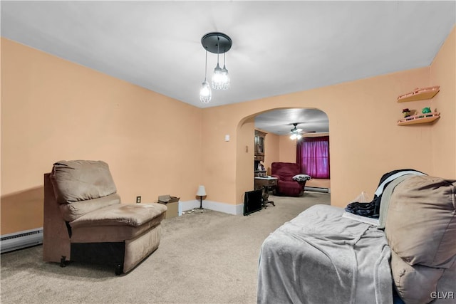 interior space featuring carpet floors, a baseboard heating unit, and ceiling fan