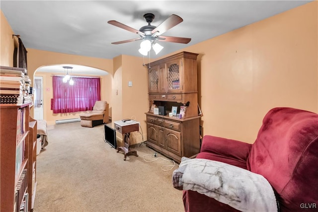 living area with ceiling fan and light colored carpet