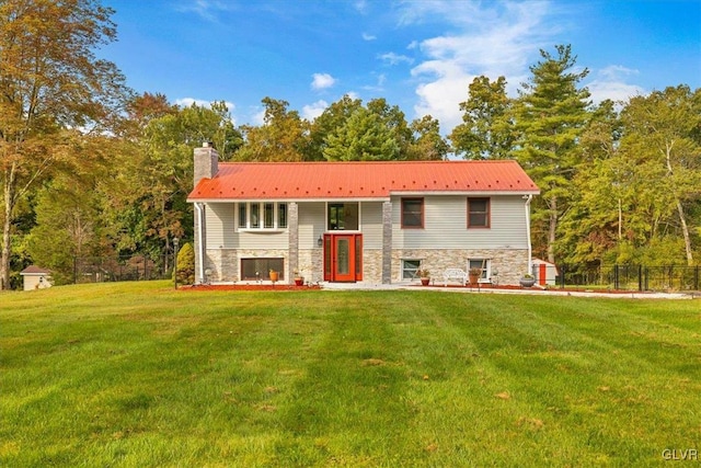 split foyer home with a front lawn