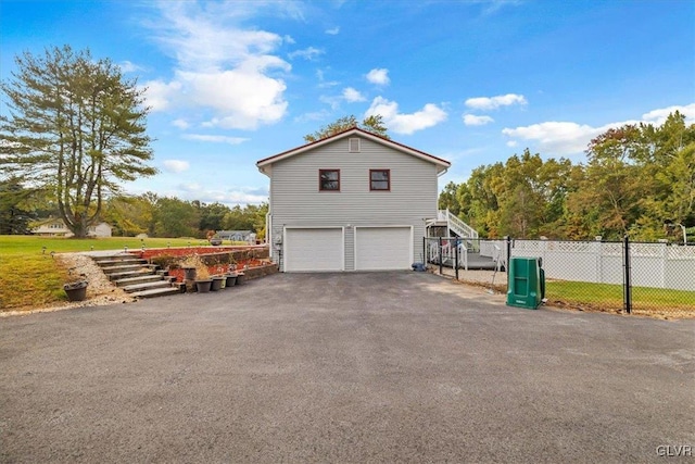 view of property exterior with a garage