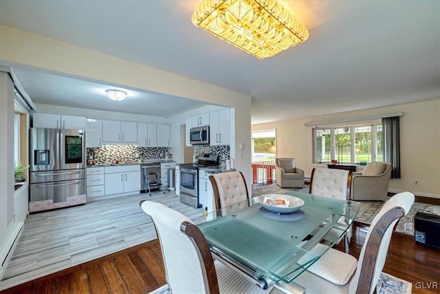 dining space featuring light hardwood / wood-style floors