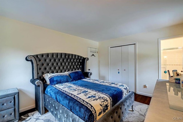 bedroom with hardwood / wood-style flooring and a closet