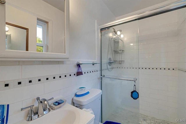 bathroom featuring tile walls, vanity, toilet, and an enclosed shower