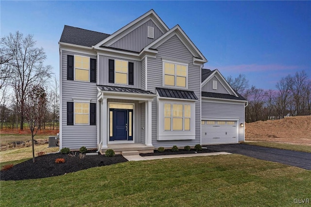 view of front of house with a lawn and cooling unit