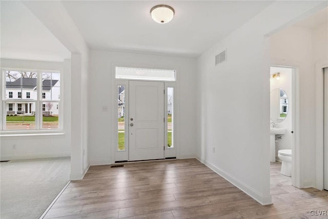 entrance foyer featuring light hardwood / wood-style floors