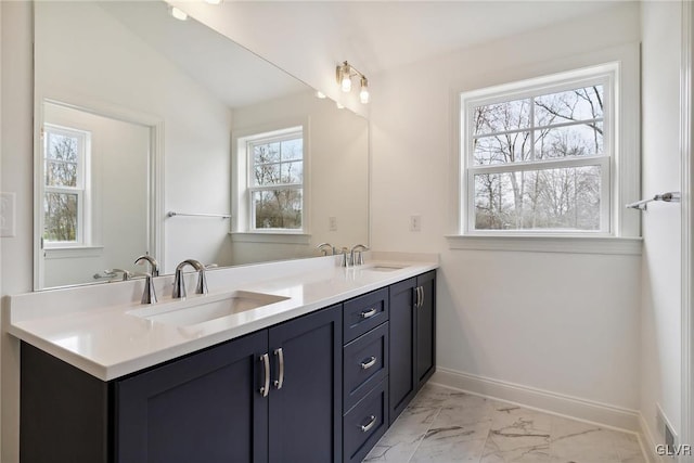 bathroom featuring vanity and vaulted ceiling