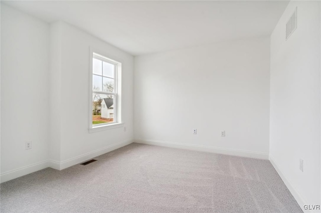 spare room featuring carpet floors