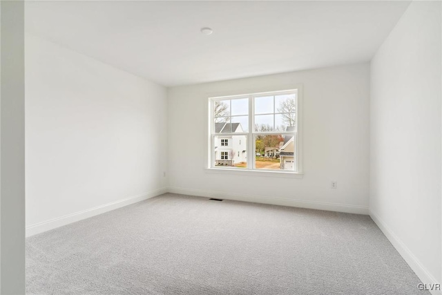 unfurnished room with carpet floors