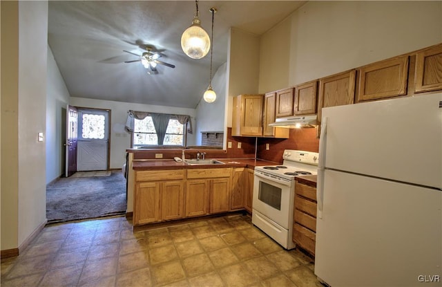 kitchen with white appliances, sink, kitchen peninsula, ceiling fan, and pendant lighting