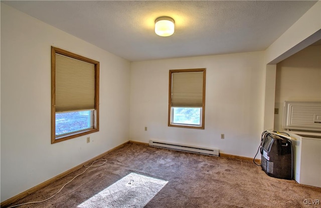 empty room with a textured ceiling, carpet flooring, and a baseboard radiator