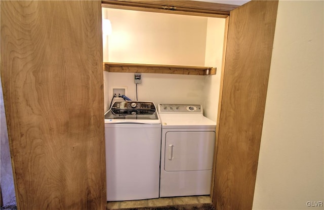 washroom featuring washer and dryer