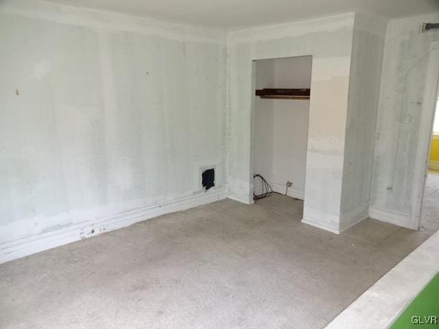 unfurnished bedroom with light carpet