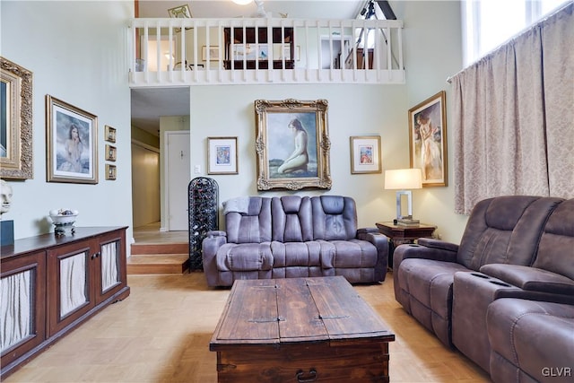 living room featuring a high ceiling