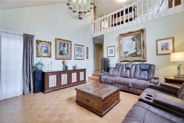 living room with high vaulted ceiling, light parquet flooring, and an inviting chandelier