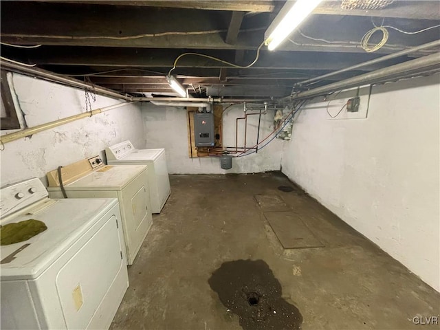 basement featuring washing machine and clothes dryer