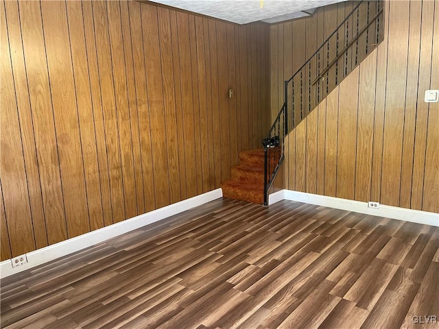 interior space featuring wood walls and hardwood / wood-style floors