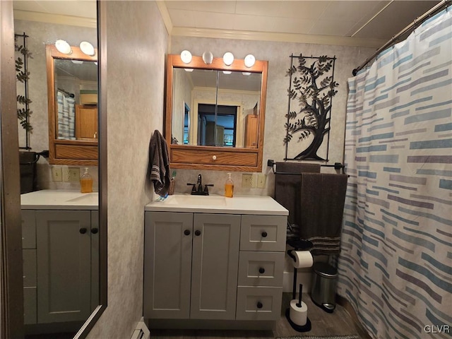 bathroom with ornamental molding and vanity