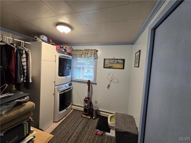 laundry area with stacked washer / dryer, crown molding, and a baseboard heating unit