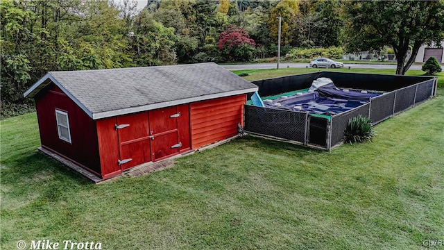 view of outdoor structure with a yard