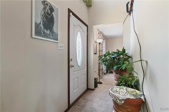 foyer entrance with light carpet