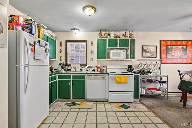 kitchen featuring green cabinets, sink, and white appliances