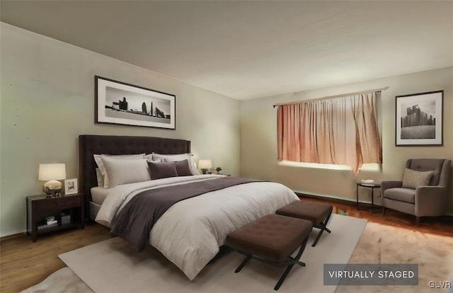 bedroom with light wood-type flooring