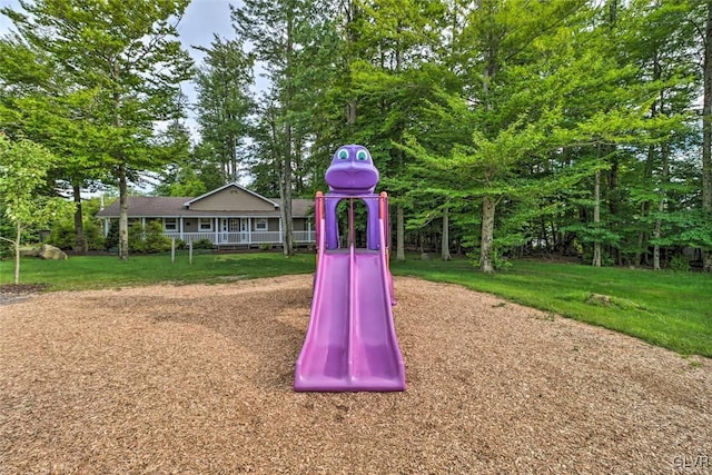 view of jungle gym featuring a lawn