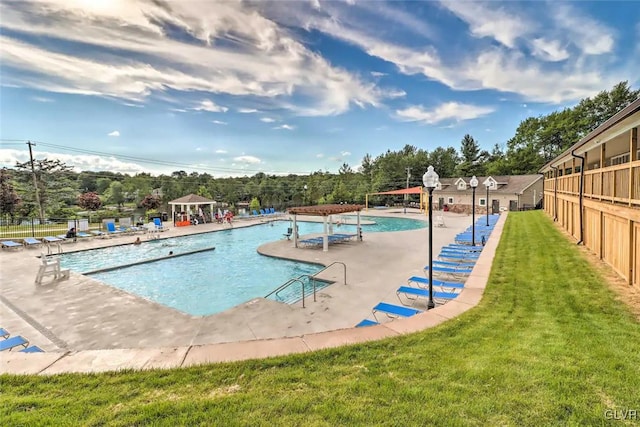 view of swimming pool featuring a patio, a gazebo, and a yard