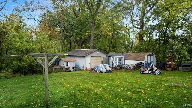 898 Browntown Rd, Plainfield Twp, PA 18064 - view of grassy yard featuring a garage and view of scattered trees