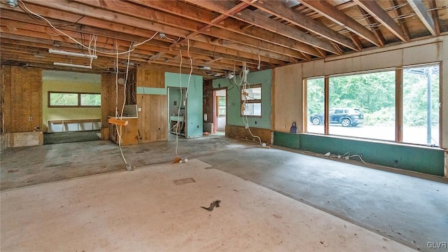 miscellaneous room with concrete floors and a healthy amount of sunlight