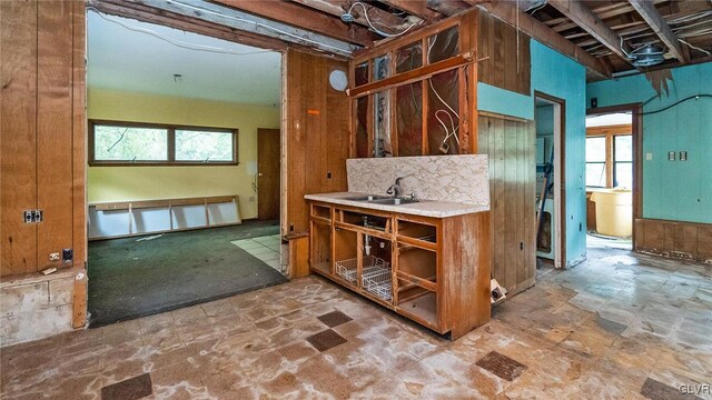 898 Browntown Rd, Plainfield Twp, PA 18064 - kitchen with brown cabinetry, stone finish flooring, a sink, light countertops, and open shelves