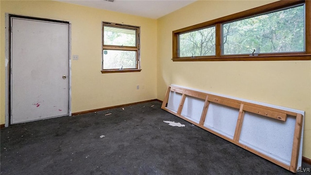 898 Browntown Rd, Plainfield Twp, PA 18064 - unfurnished room with dark colored carpet and baseboards
