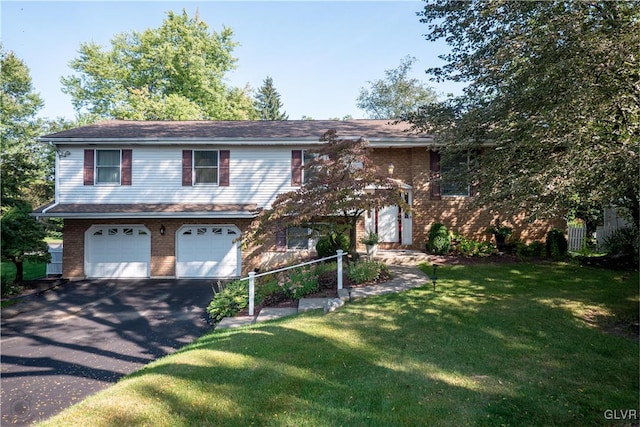 bi-level home featuring a front yard and a garage