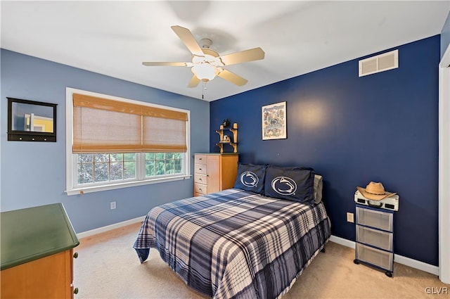 bedroom featuring light carpet and ceiling fan