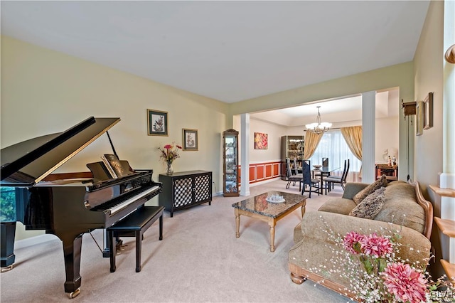 living room featuring an inviting chandelier and light colored carpet