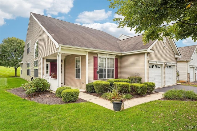 view of front of property featuring a garage and a front lawn