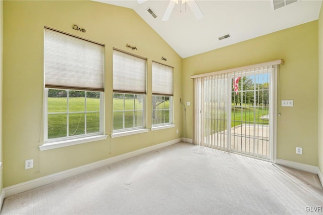 carpeted empty room featuring ceiling fan and lofted ceiling