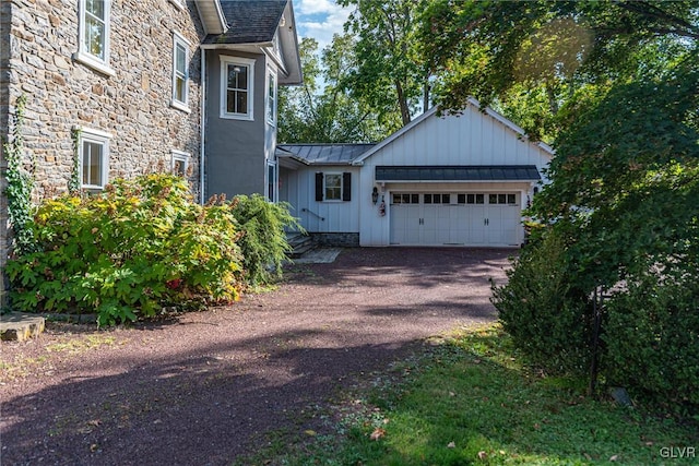 view of property exterior with a garage