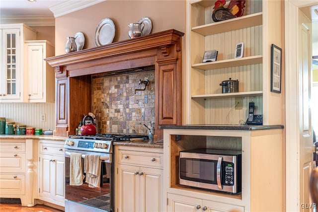 kitchen with appliances with stainless steel finishes, light hardwood / wood-style floors, tasteful backsplash, light stone countertops, and ornamental molding