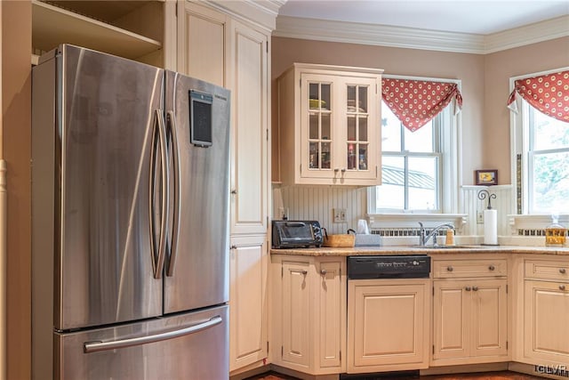 kitchen with light stone counters, stainless steel fridge, ornamental molding, sink, and dishwasher