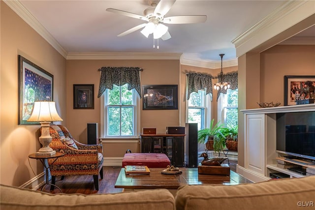 sitting room with wood-type flooring, ceiling fan with notable chandelier, and crown molding