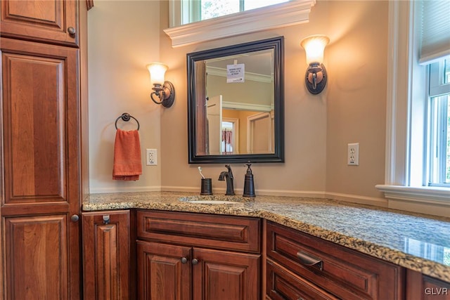 bathroom with vanity and crown molding